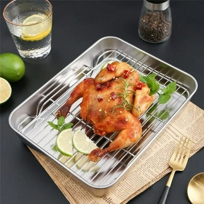plaque de cuisson poulet lime citron poivre journal fourchette comptoir noir