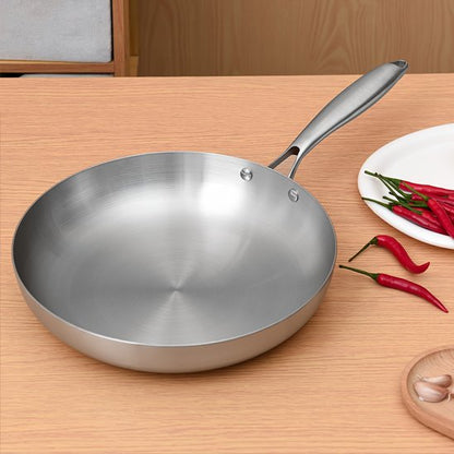 poele inox piments comptoir bois